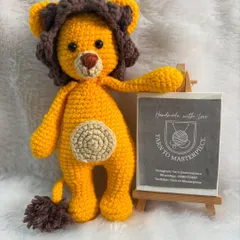 A majestic and friendly lion toy, complete with a fluffy mane and tail. This amigurumi lion is ready to rule the playroom.
