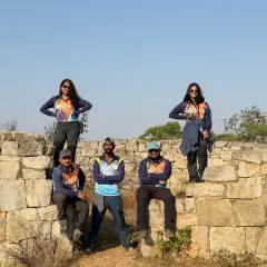 Our team members posing on the fort walls during the Women's Day trek. We are proud to foster an environment of empowerment and leadership.