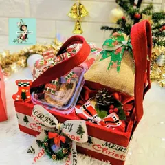 My Christmas Santa delectable hamper. This festive red basket is filled with cookies and other treats, perfect for a Secret Santa gift or just to spread some holiday joy.