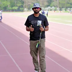 On the field at the Khelo Masters Games. I use a stopwatch and other tools to ensure accurate performance tracking for over 2500 master athletes.