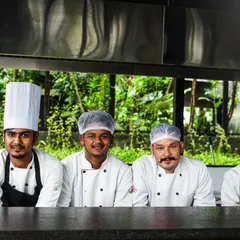 Our secret sauce? The magic touch of our talented chefs. Here's part of the team from our live kitchen.