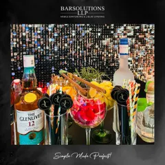 The bar top at an exclusive private party, showcasing premium spirits like The Glenlivet 12 and a beautiful array of fresh garnishes and custom stirrers.