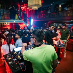 A view from behind the console of a completely packed venue. My job is to conduct this energy, and from this perspective, I can see and feel every beat resonate through the crowd.