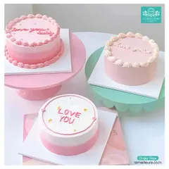 For those who love understated elegance, I design minimalist Korean-style cakes. These bento cakes feature simple pastel ombre frosting and personalized messages like 'Love You', making them perfect for intimate celebrations, anniversaries, or just because.