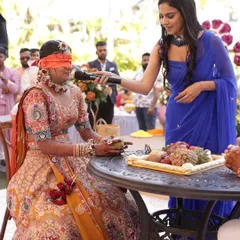 A blindfold game with the bride during her Haldi ceremony. These games are all about creating fun, light-hearted moments centered around the couple.