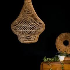 The bamboo pendant light, unlit. Its sculptural form and natural texture make it a beautiful object even when the light is off.