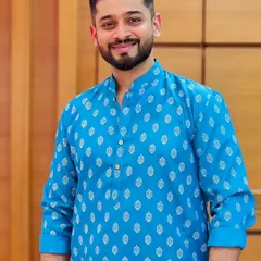 A clean, bright, and friendly look in a classic blue kurta. This image is perfect for ethnic wear brands looking for a model who can represent everyday traditional fashion with a warm and approachable smile.