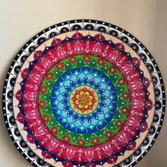 Another one of my large 24-inch mandalas, this piece features a rainbow of colors that radiate from the center. The dotting technique gives it a beautiful texture and depth, making it a truly unique piece of wall decor.