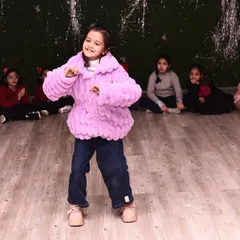One of our youngest students showing off her moves during the Christmas party. Our celebrations are for every member of the family.