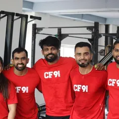 Our 'Ohana' in our matching red CF91 shirts. This picture captures the spirit of togetherness and family that is at the core of our gym. We are a team, inside and out.