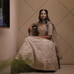 A full view of a stunning reception lehenga look. I focused on creating a luminous makeup style that complemented the intricate silver embroidery of her outfit.