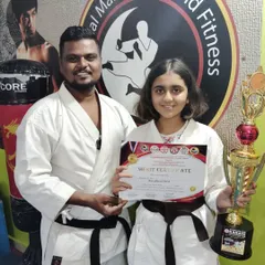 Celebrating the success of our karate champion. Her trophy and certificate are symbols of her hard work, discipline, and the high standards we uphold at our academy.
