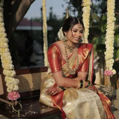 The serene South Indian beauty. For this bride, I emphasized her natural features with a calm, graceful makeup look that complements her traditional white and red silk saree.