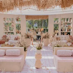 I transformed an open lawn into a complete 'Desert Oasis' for this unique Haldi ceremony. The setup featured custom-built structures, cohesive lounge seating with themed upholstery, and a color palette of earthy tones to create an immersive, elegant experience.