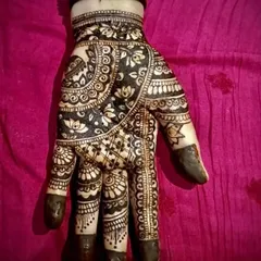 A close-up of a single hand showing intricate floral work. I used a reverse-fill technique here as well to create a bold and dramatic effect, perfect for making a statement.