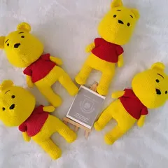 A collection of my Winnie the Pooh soft toys. These 10-inch dolls are made with his classic red shirt and are perfect for cuddling.