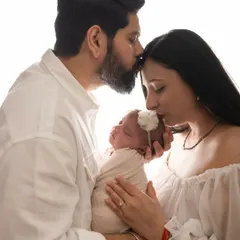 There is such a profound calmness in the love for a newborn. This is a moment from a bright and airy studio newborn session, where I focus on capturing the gentle, intimate connection between new parents and their baby.