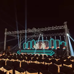 This is a stage built for performance. For this sangeet night, we constructed a large metal truss system equipped with professional spotlights and a custom LED backdrop, ready for a night of music and dance.