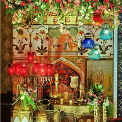 We specialize in creating rich, thematic experiences like this authentic Sufi Night setup. The decor features traditional Mughal art panels, ornate brass lanterns, and deep-hued florals to evoke a soulful and mystical ambiance for your special event.