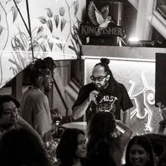 More than just a DJ, I’m an MC rooted in sound system culture. This shot captures me on the mic, hosting the night and keeping the crowd's energy high. I can run the show or just hype the vibe, whatever the event needs.