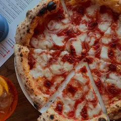Our Goan Sausage pizza is a whole vibe. We pair it with a crisp Aperol Spritz for that perfect balance of spicy, smoky, and refreshing. It's a flavour punch that hits all the right notes.