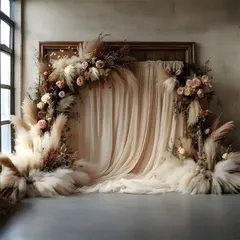 A dreamy boho backdrop using flowing fabric and arrangements of pampas grass and dried flowers. This is ideal for creating a soft, romantic atmosphere for a baby shower or ring ceremony.