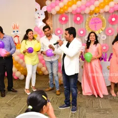 Leading a balloon game for the adults at a 'Some Bunny is One' first birthday party in Bangalore. My goal is to make sure everyone feels included and has a chance to participate.