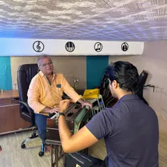A moment of one on one guidance. Here, our guru is teaching a student the finer points of a melody on the harmonium. This personal attention is crucial for growth.
