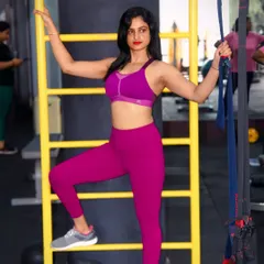 Feeling strong, confident, and unstoppable. Posing with the TRX suspension trainer, a great tool for full-body workouts.