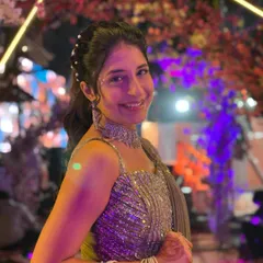 A close-up shot highlighting the sparkling blouse and the elegant pearl-studded hairstyle, which can be complemented by my rental jewellery. This look is all about effortless glamour.