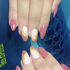 This elegant design features a dusty rose base on almond-shaped nails. The accent nails have a marbled look with a touch of gold foil for a sophisticated finish.