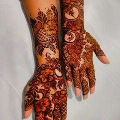 Another angle of the hibiscus henna, showing the beautiful flow of the design from the palm to the forearm.
