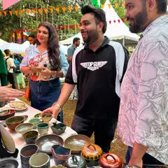 A group of friends checking out the handmade pottery at my festival stall. Events like these are a fantastic way to spend a weekend, surrounded by art, music, and creative energy.