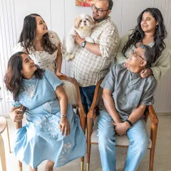 A beautiful multi-generational family portrait celebrating Kyro's birthday. It shows how a pet brings the entire family together for moments of joy and celebration.