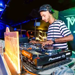 Deep in the mix at Cafe Mambo. This is where I am most comfortable, blending tracks and adjusting frequencies to build the perfect sound for the room.
