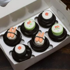 Who says you can't have sushi for dessert? I had a blast creating these quirky sushi-themed cupcakes. Each piece, from the shrimp nigiri to the maki rolls, is handcrafted from fondant and sits on a swirl of rich chocolate frosting.