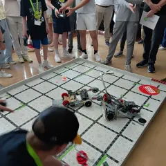 Our training opens doors to the world's most prestigious institutions. This image shows one of our 7th graders in the midst of a VEX Robotics battle during a summer camp at the Massachusetts Institute of Technology (MIT). We encourage students to pursue these high-level opportunities to deepen their tech and engineering knowledge.