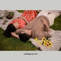 A relaxed and intimate shot of a couple lying on a picnic blanket, sharing a quiet moment together. This is what capturing real 'pyar' looks like.