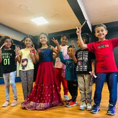 It's all about smiles and making friends at the studio. Here's a happy group of kids celebrating a friend's birthday after a fun dance session.