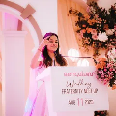 Connecting with the audience at a professional wedding event. I love sharing my passion for hosting with other artists and event managers.