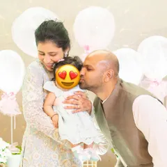 A precious family moment from my daughter Siya's celebration. My outfit was coordinated with hers, showing that even as a new mom, you can plan stylish and memorable looks for family events.