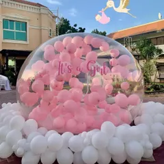 It's a girl! The bubble house is filled with pink balloons, creating a stunning visual for the gender reveal announcement.