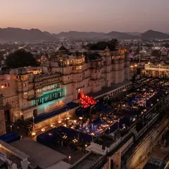 The entire city palace complex in Udaipur, viewed from above during a Sangeet we planned. This shot captures the immense scale and electric atmosphere of the celebration.
