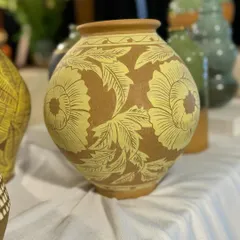 One of the beauties from this season. This vase features a bold, hand-carved floral design using the sgraffito technique on a rich yellow slip.