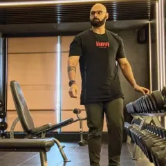 A candid moment in the gym. Always focused on the task at hand. Remember to rerack your weights.