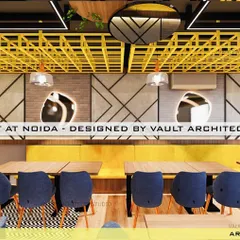 Another view from our restaurant design, highlighting the geometric wall patterns, modern lighting, and the striking yellow lattice on the ceiling that adds a bold design statement.
