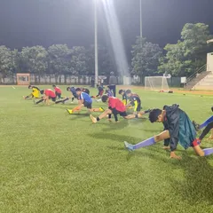 Our U13s demonstrate a dynamic stretching routine during a night session. We emphasize proper warm-ups and conditioning to build strength and prevent injuries for players of all ages.