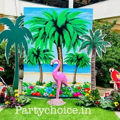 We use a variety of props to build an immersive theme. This photo spot features a painted beach-scene backdrop, palm tree cutouts, and 3D figures of a flamingo and tropical birds.