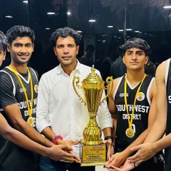 Here I am with our state champions, holding the trophy they earned through sheer grit and passion. Seeing our students shine on such a big stage is the greatest reward for a coach.