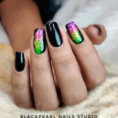 A bold and artistic design combining timeless black nails with a vibrant pigment art accent. I used colorful pigments to create a bright, abstract splash of color against the dark base for a high-contrast, statement look.